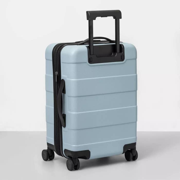 The swivel luggage in baby blue