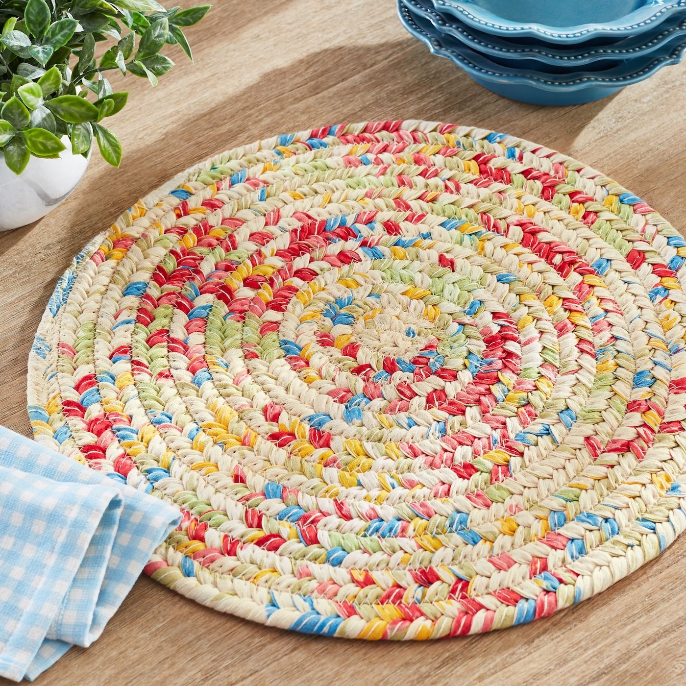 The round placemat with a multi-colored pattern on a table
