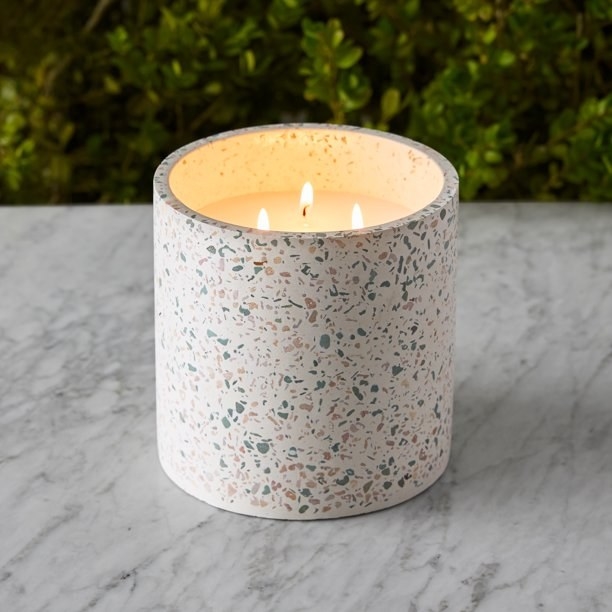 citronella candle in a terrazo print votive