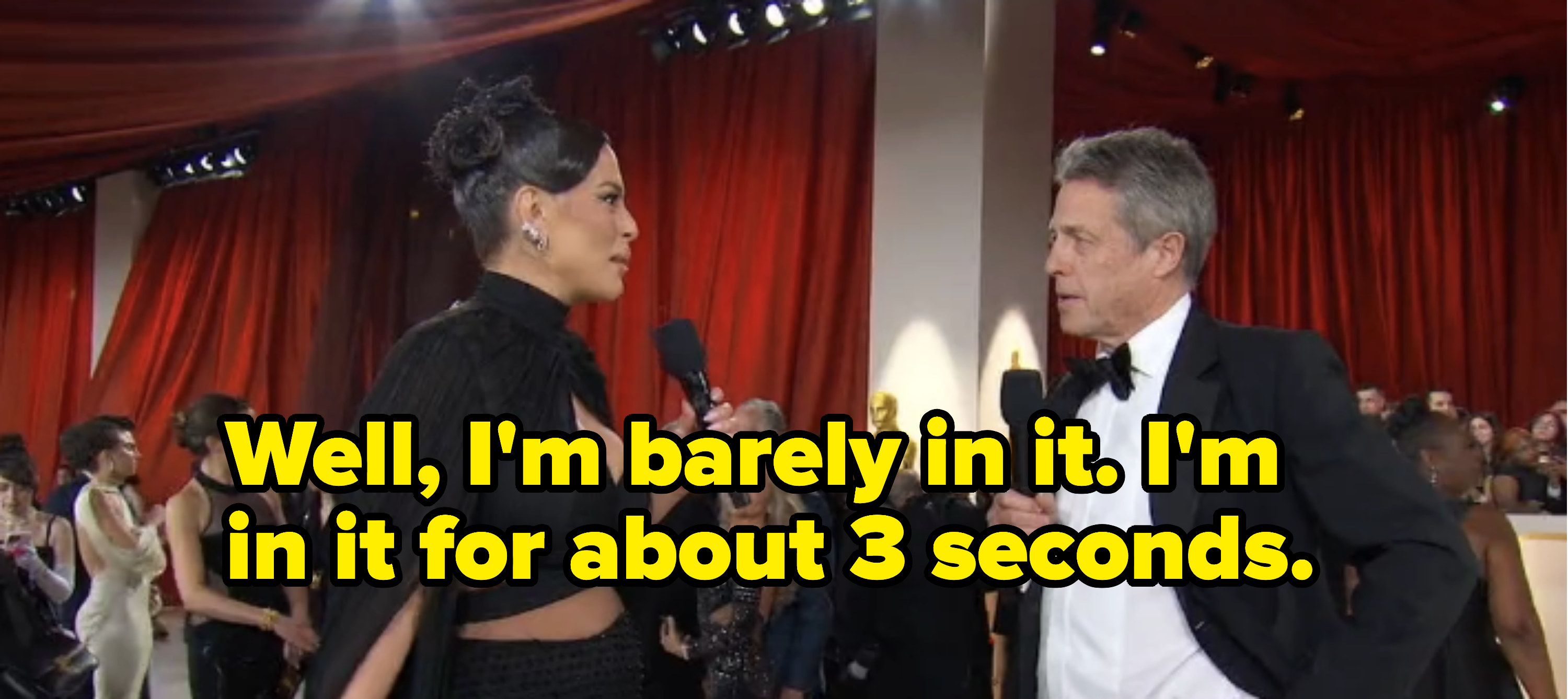 Ashley Graham interviewing Hugh Grant