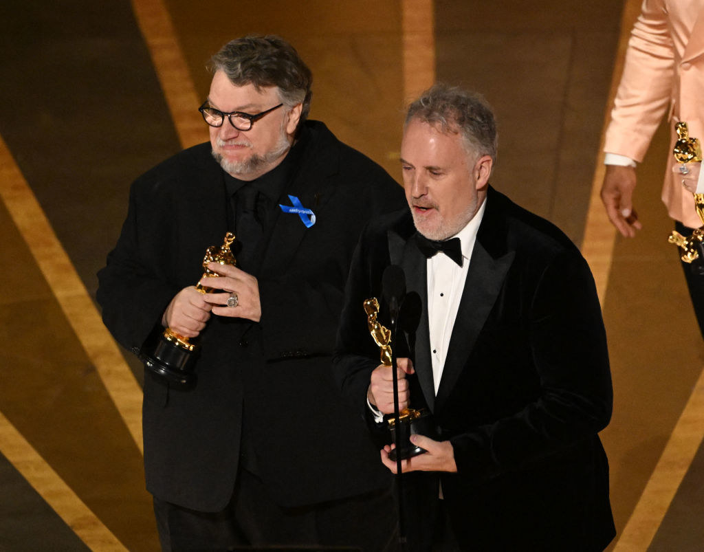 Director Guillermo del Toro and Mark Gustafson accept the Oscar for Best Animated Feature Film