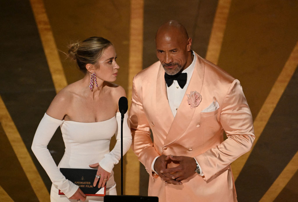 Emily Blunt US actor Dwayne Johnson speak onstage during the 95th Annual Academy Awards