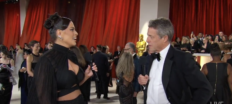 Ashley Graham interviewing Hugh Grant