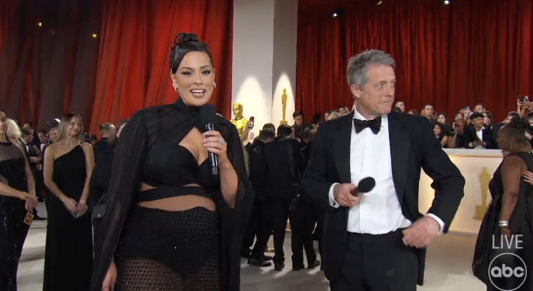 Ashley Graham interviewing Hugh Grant