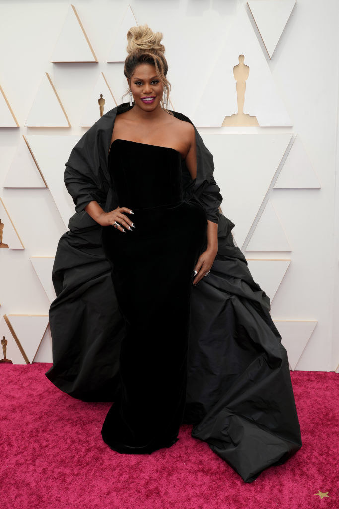 Laverne in a strapless gown with long cape