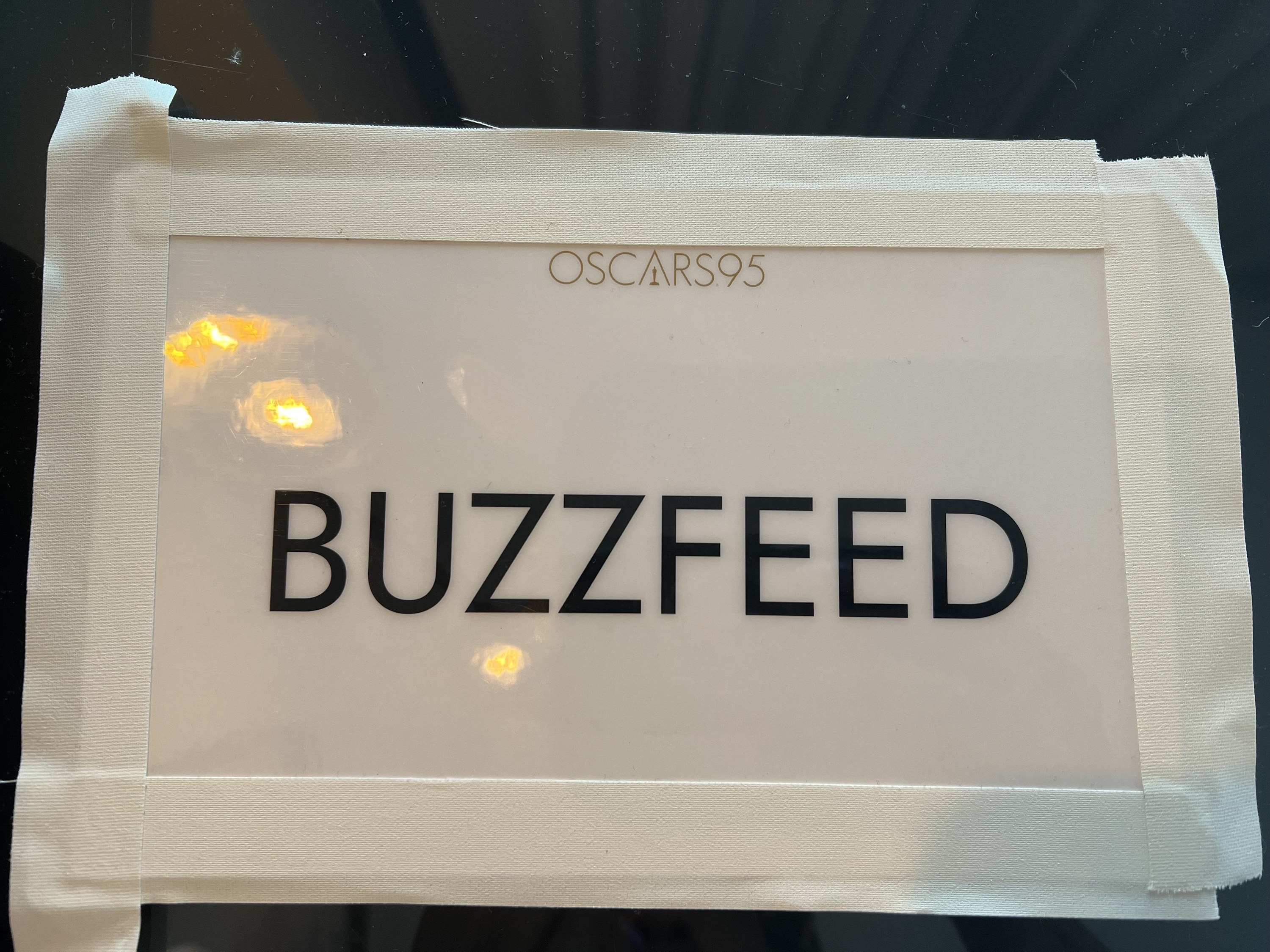 A closeup of a BuzzFeed placard
