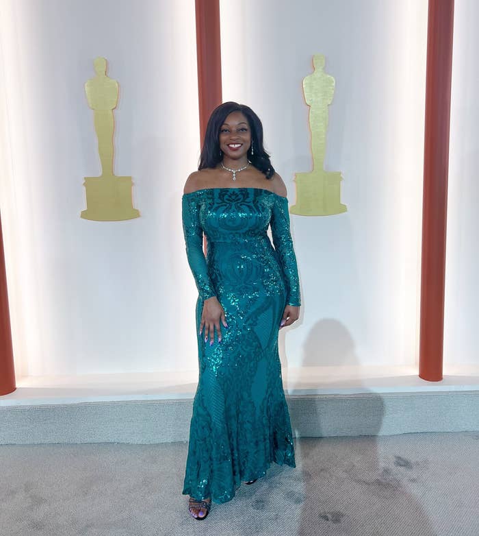 Morgan poses on the champagne Oscars carpet in an off-the-shoulder, long-sleeved sequined gown