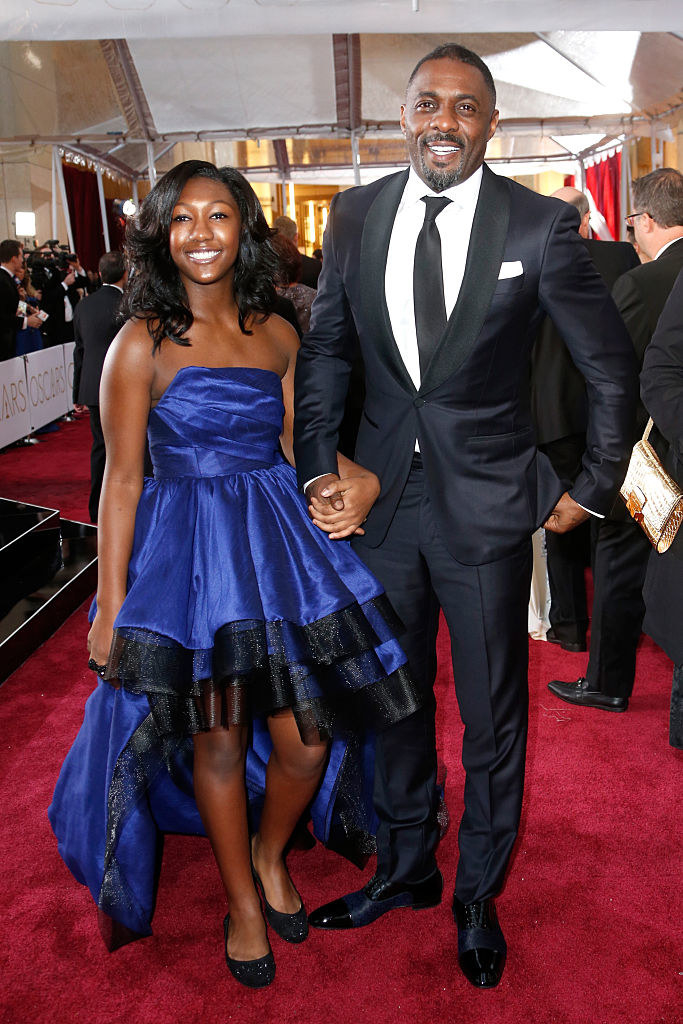 Idris on the red carpet hand in hand with his daughter, Isan