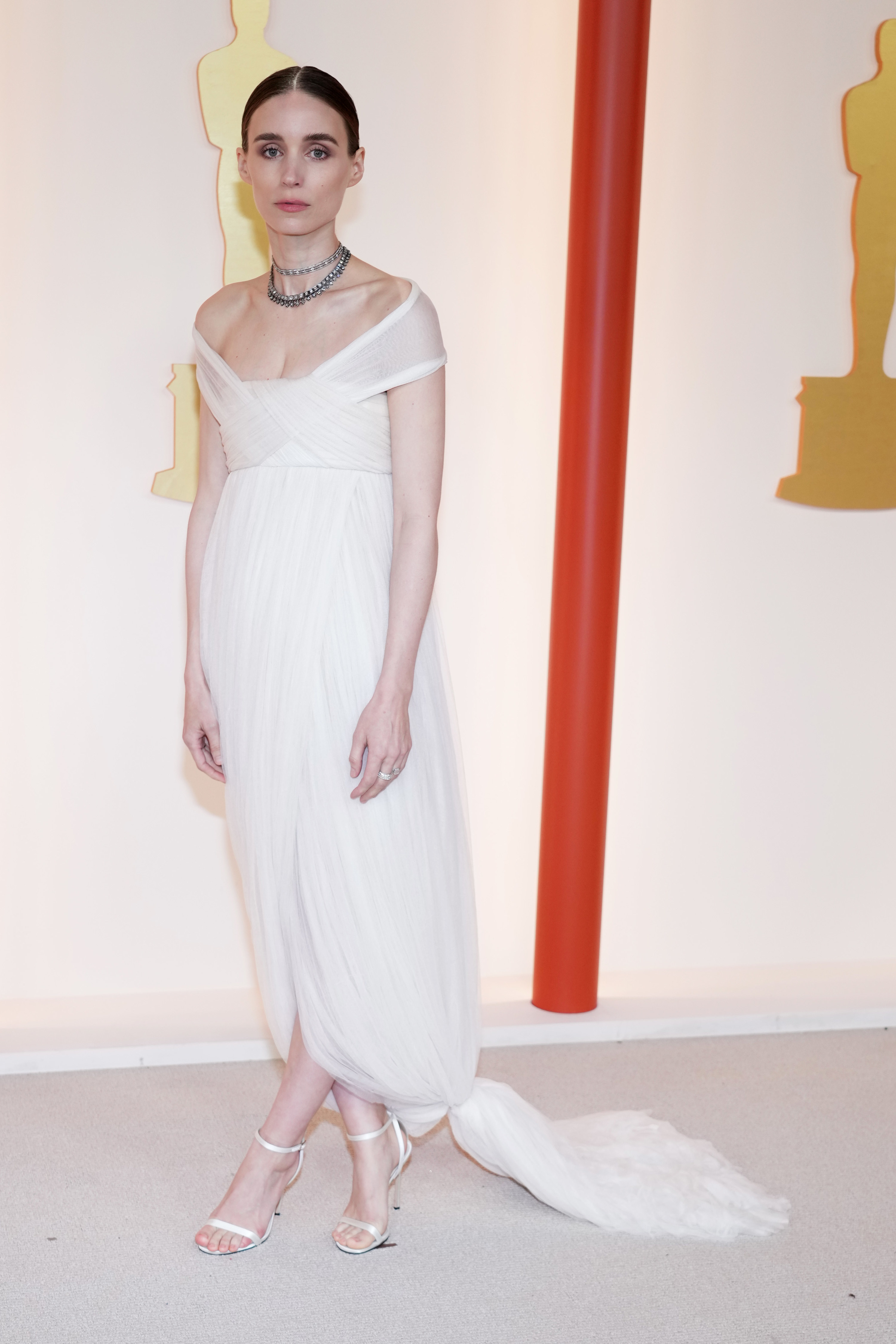 Rooney in an off-the-shoulder gown with small train