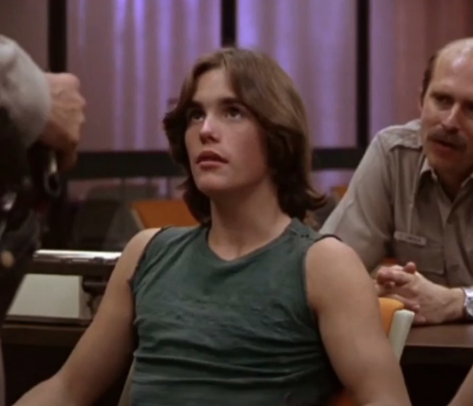 Matt Dillon as Richie listens to a police officer in &quot;Over the Edge&quot;