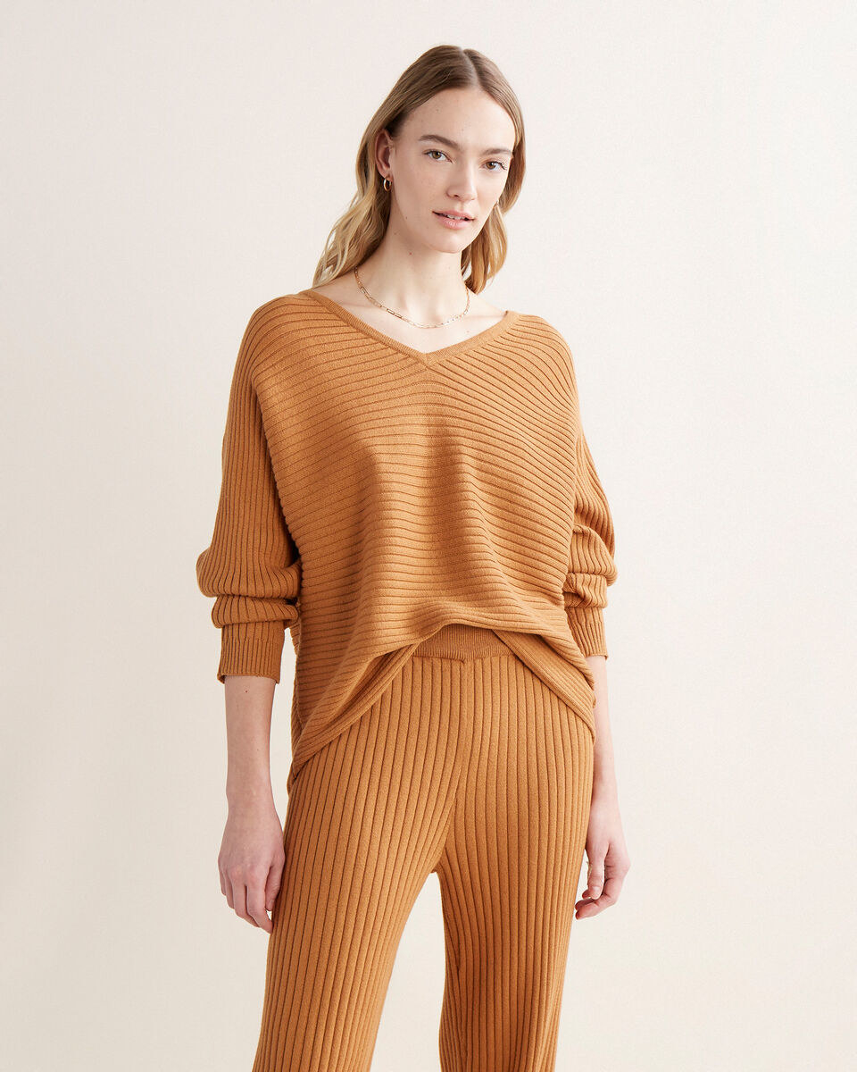 a person wearing the oversized v neck sweater with matching pants