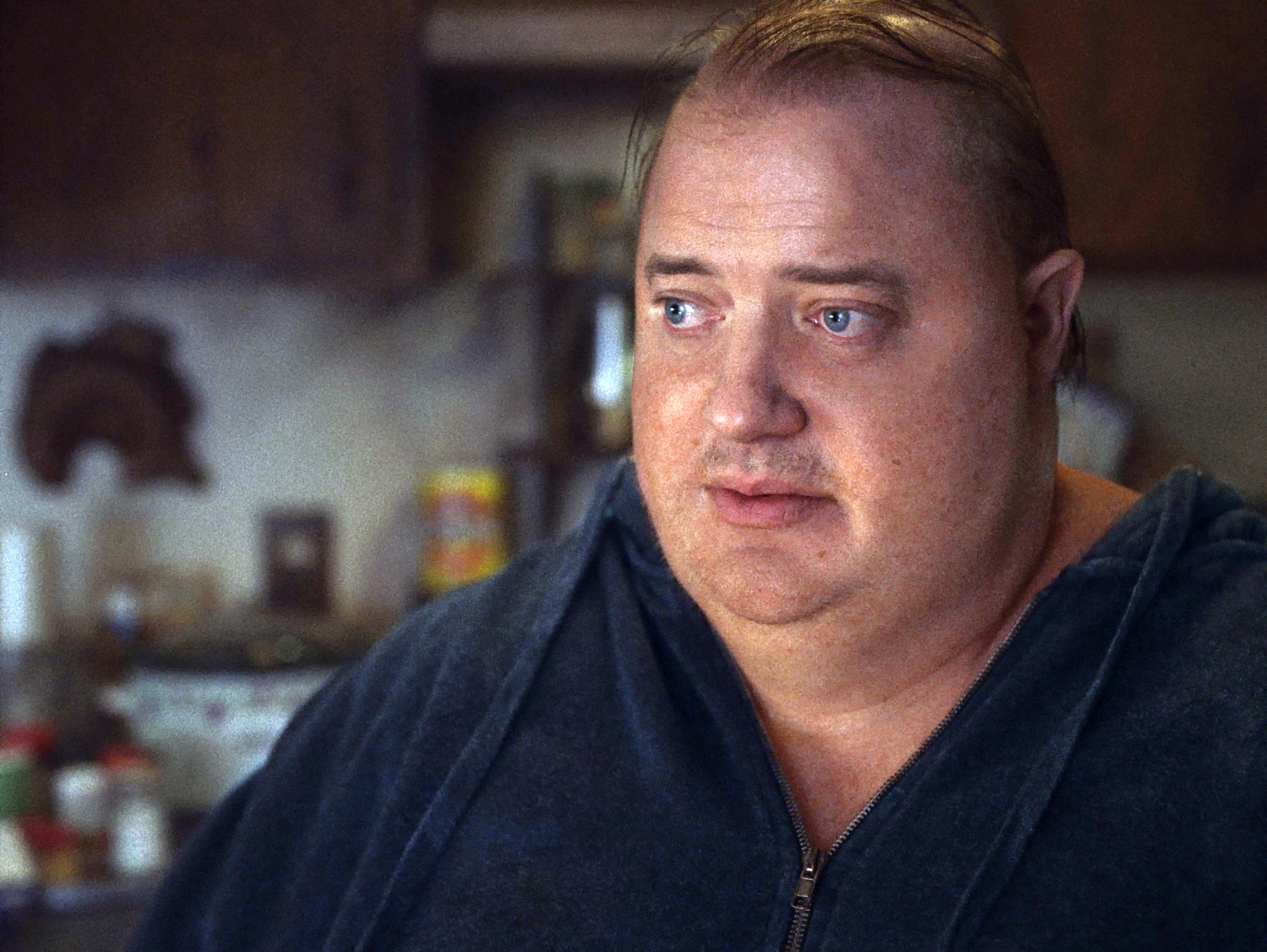 A closeup of Brendan in prosthetics and a fat suit in a scene from the film