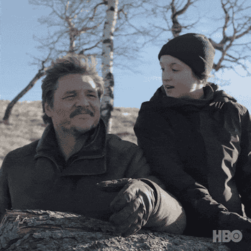 Pedro Pascal and Bella Ramsey as Joel and Ellie sharing a nice moment together