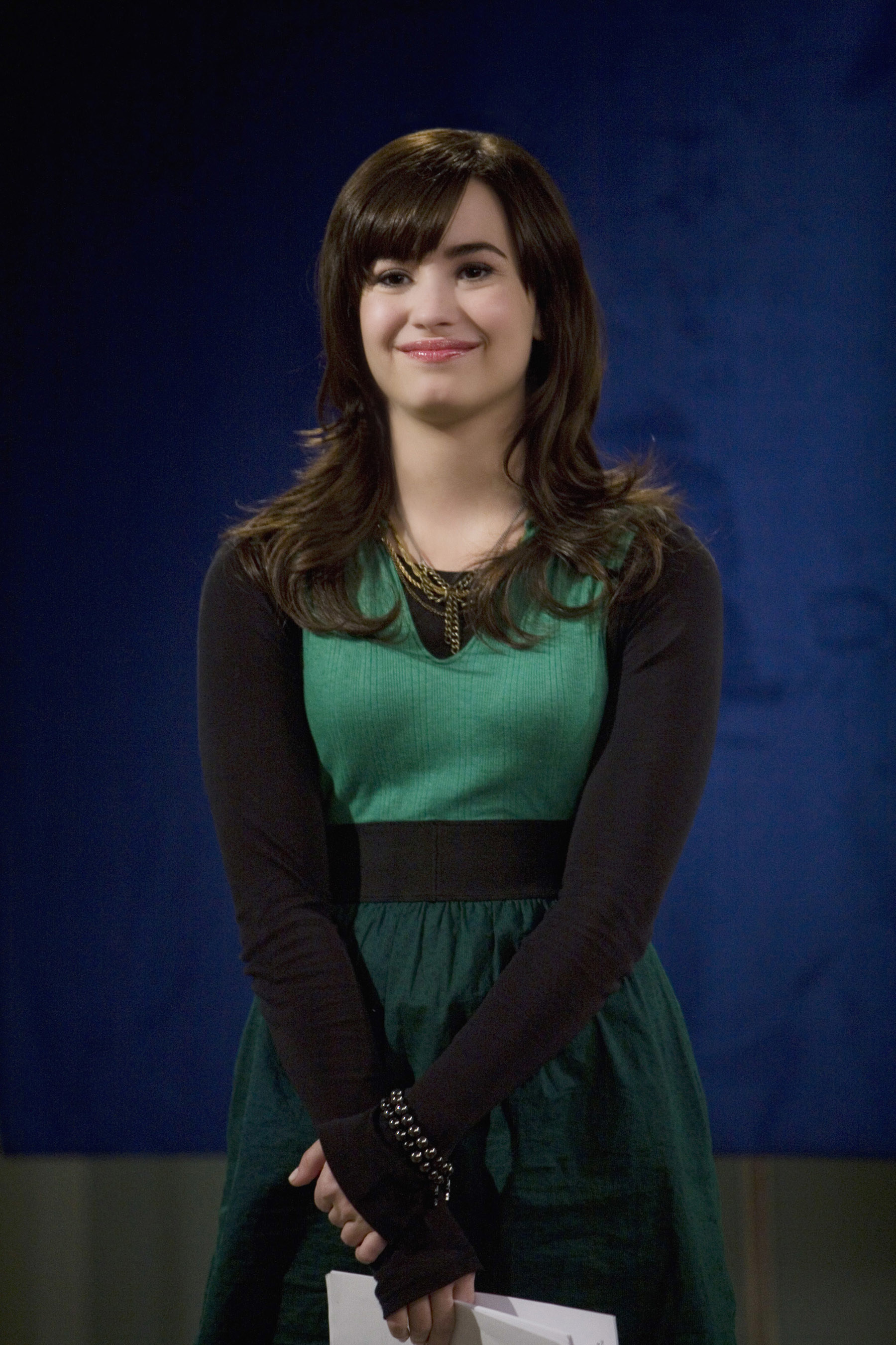 A younger Demi smiling
