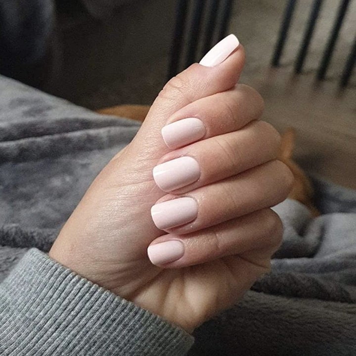 reviewer wearing press-on nails