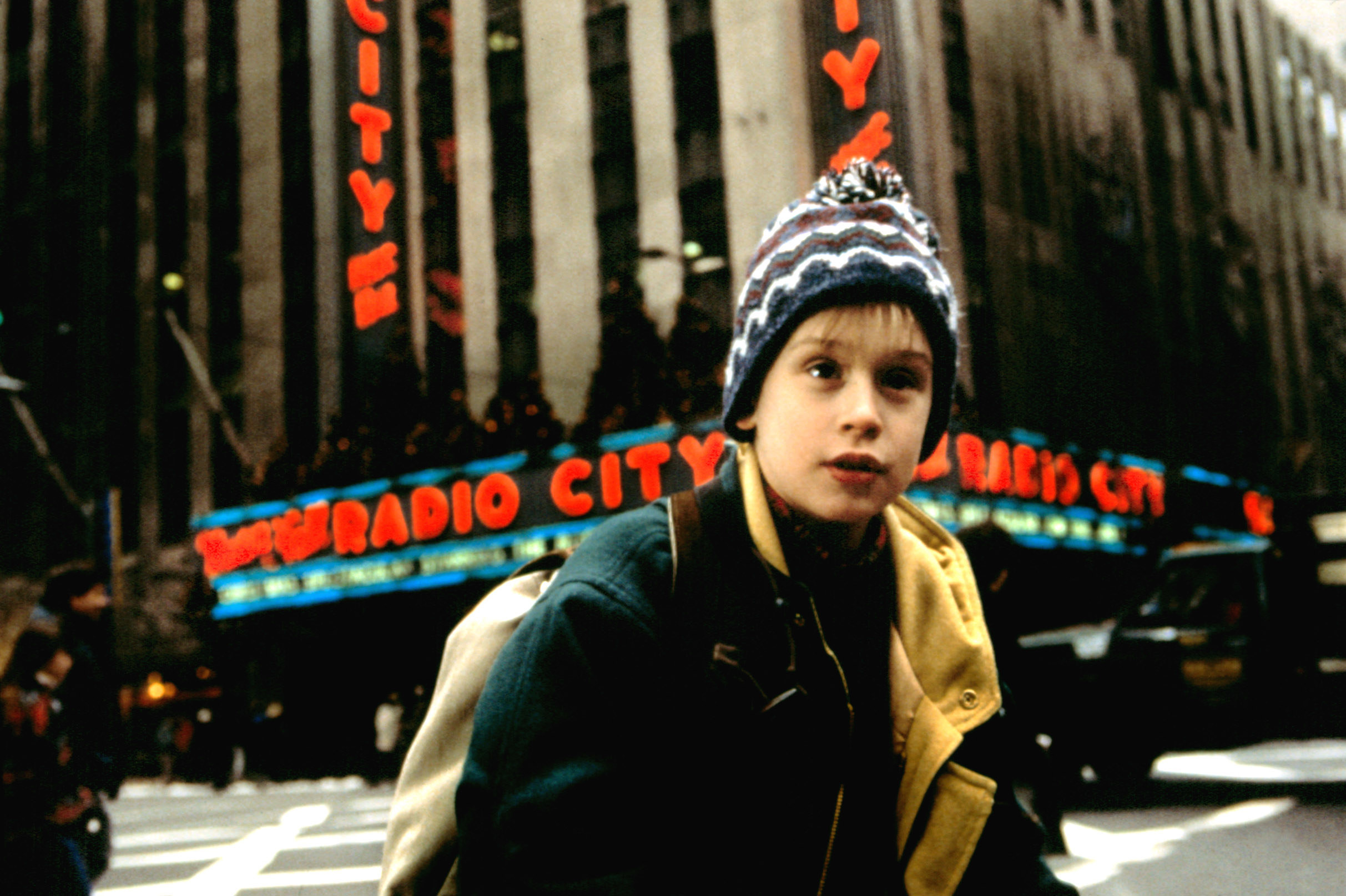 Macaulay as a child in front of Radio City Music Hall