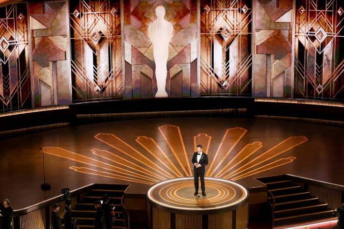 Host Jimmy KImmel stands in the middle of the Oscars stage