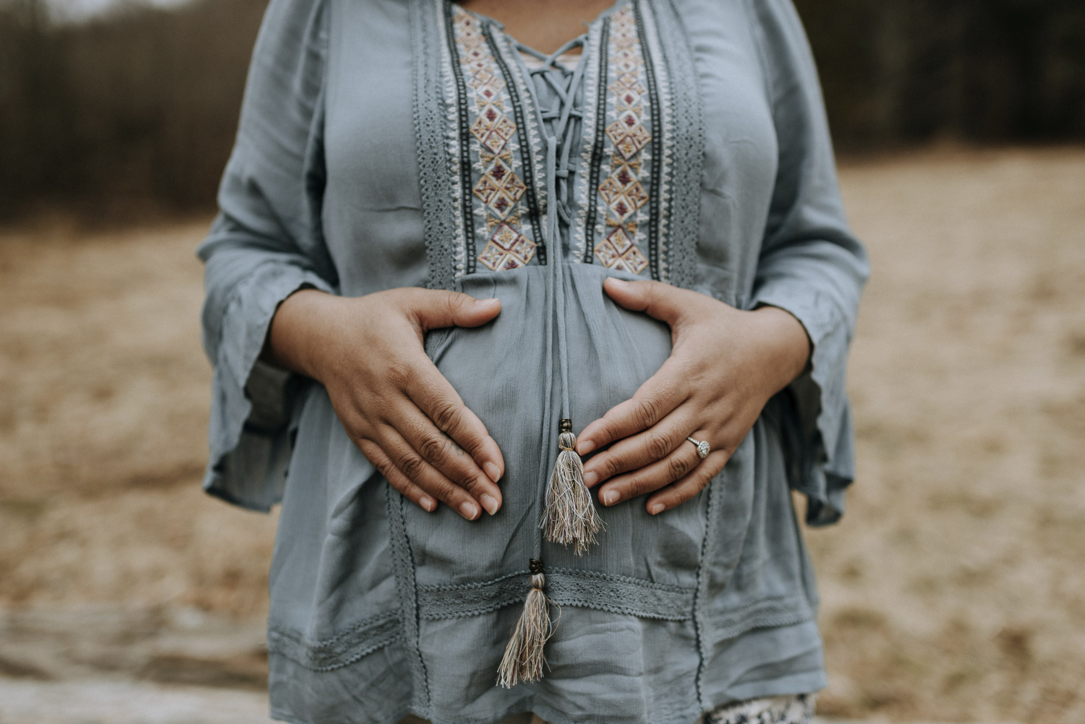 A woman cupping her belly