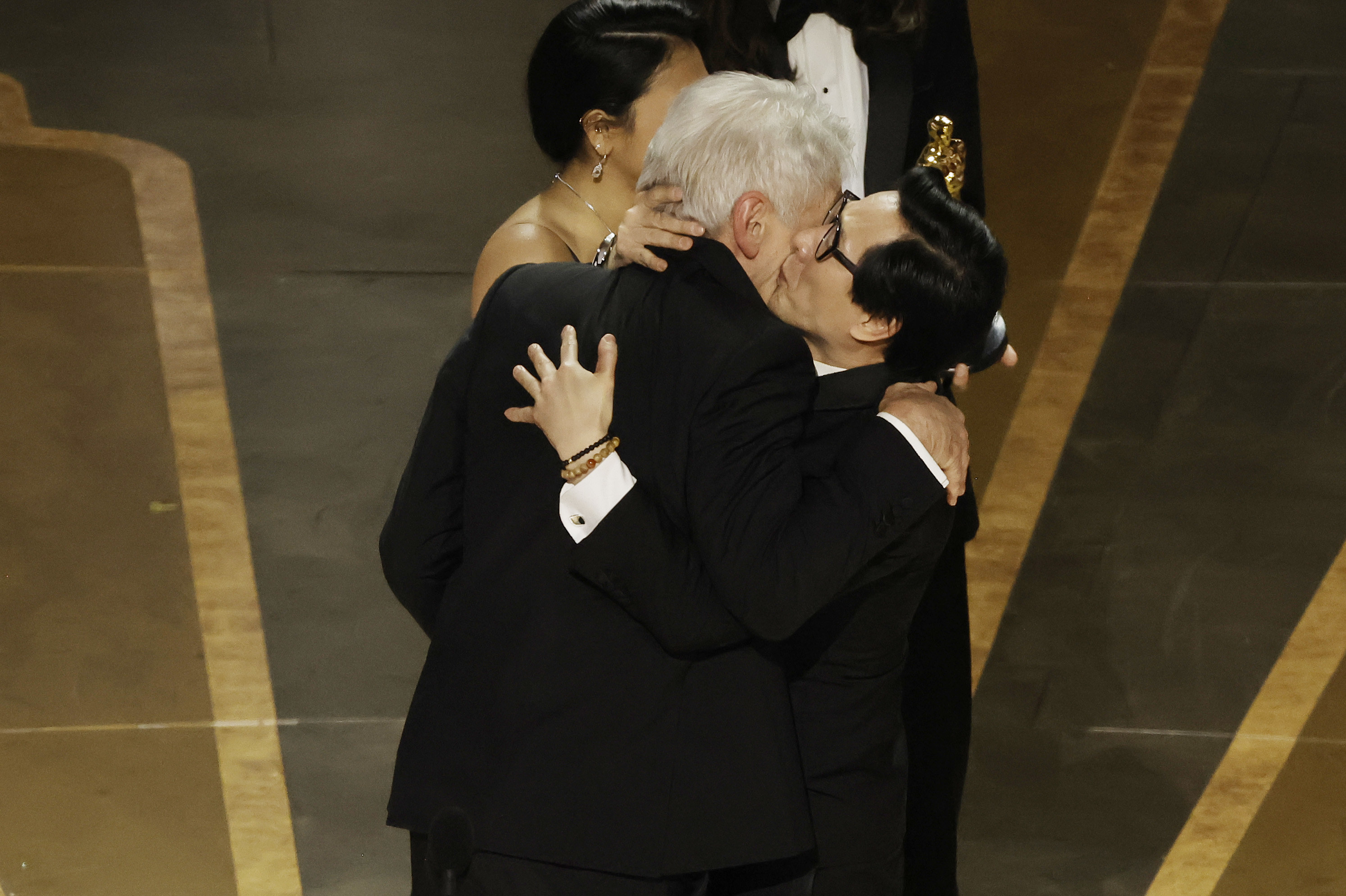 Ke Huy Quan kisses Harrison Ford&#x27;s cheek on stage