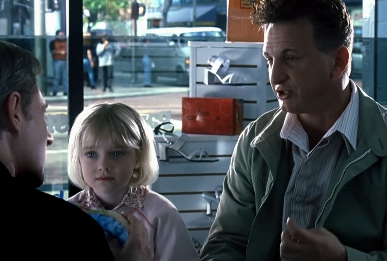 Dakota Fanning as Lucy looks for shoes with her dad, Sam