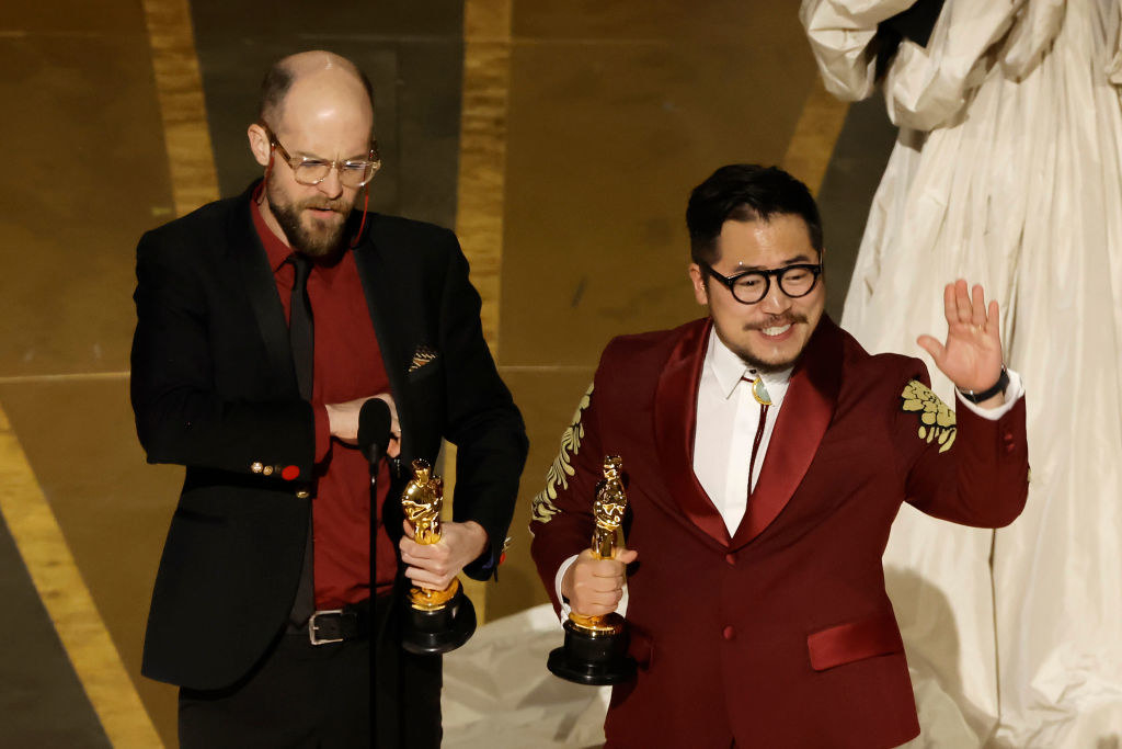 Daniel Scheinert and Dan Kwan accept the Best Original Screenplay award for &quot;Everything Everywhere All at Once&quot;