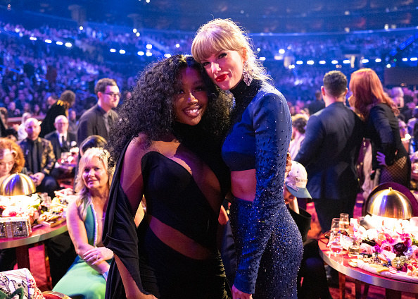 photo of SZA and Taylor Swift hugging together at the Grammys