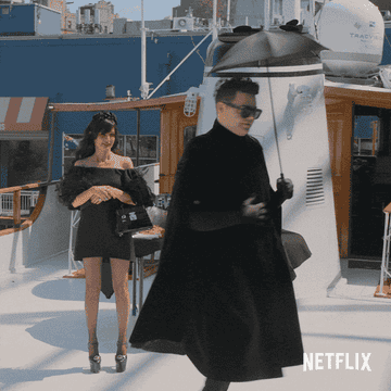 a gif of someone twirling in an all-black outfit