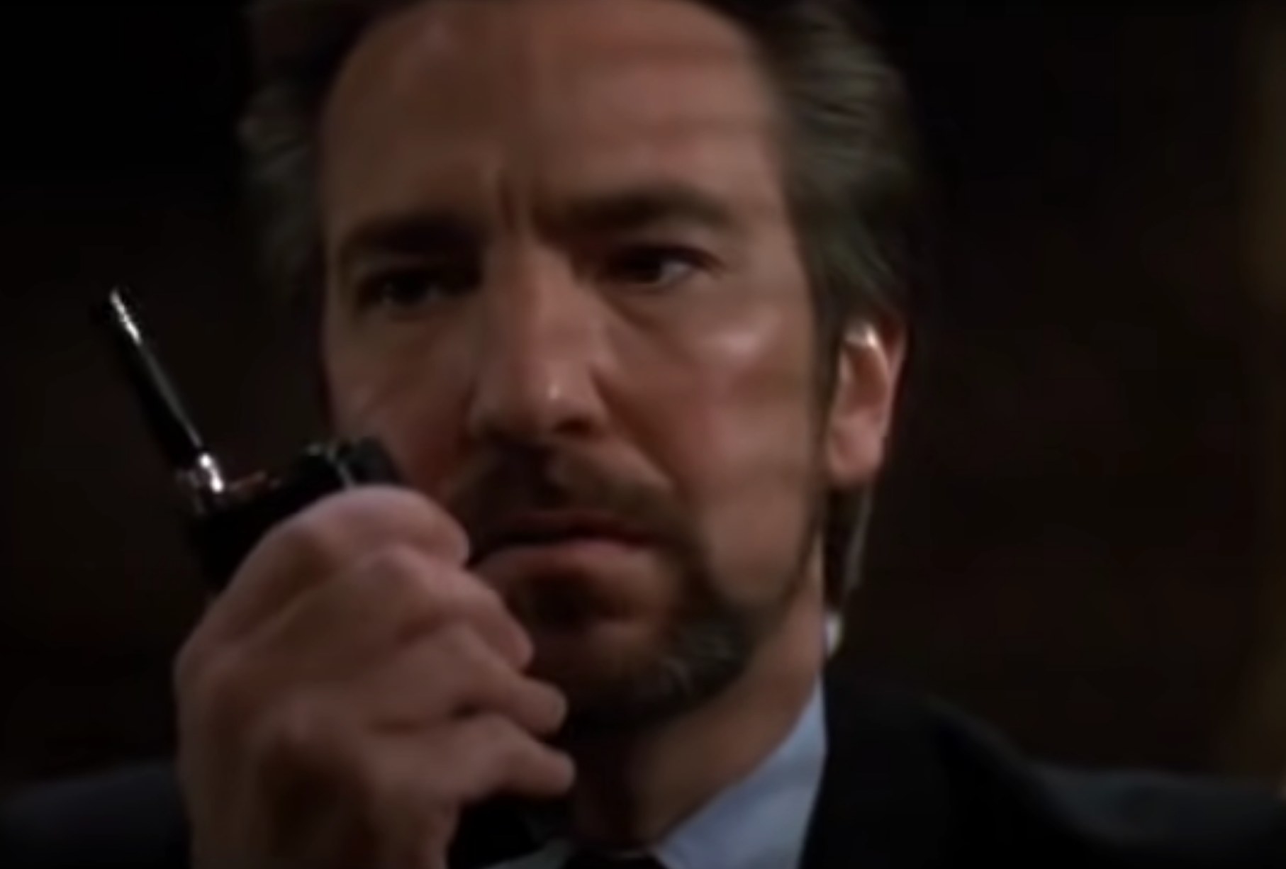 Alan Rickman as Hans Gruber speaks in a walkie talkie in &quot;Die Hard&quot;