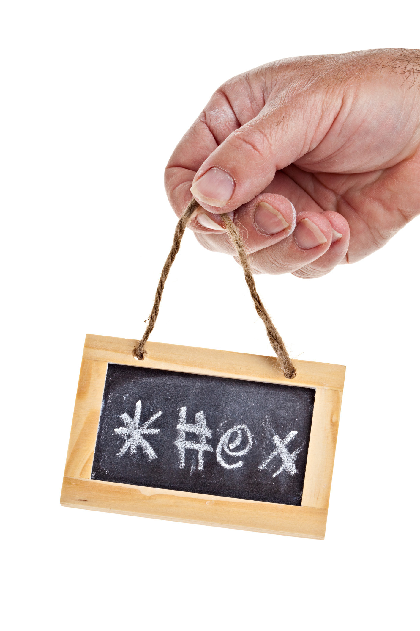 A hand holding a mini chalkboard with symbols on it