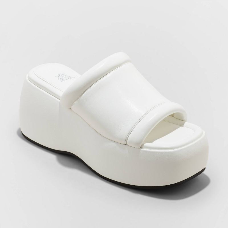 The white slip-on sandals