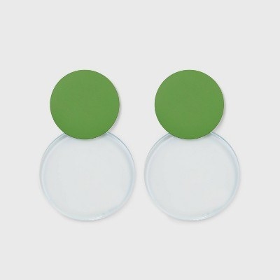 The large earrings, with a solid green round charm above a translucent one