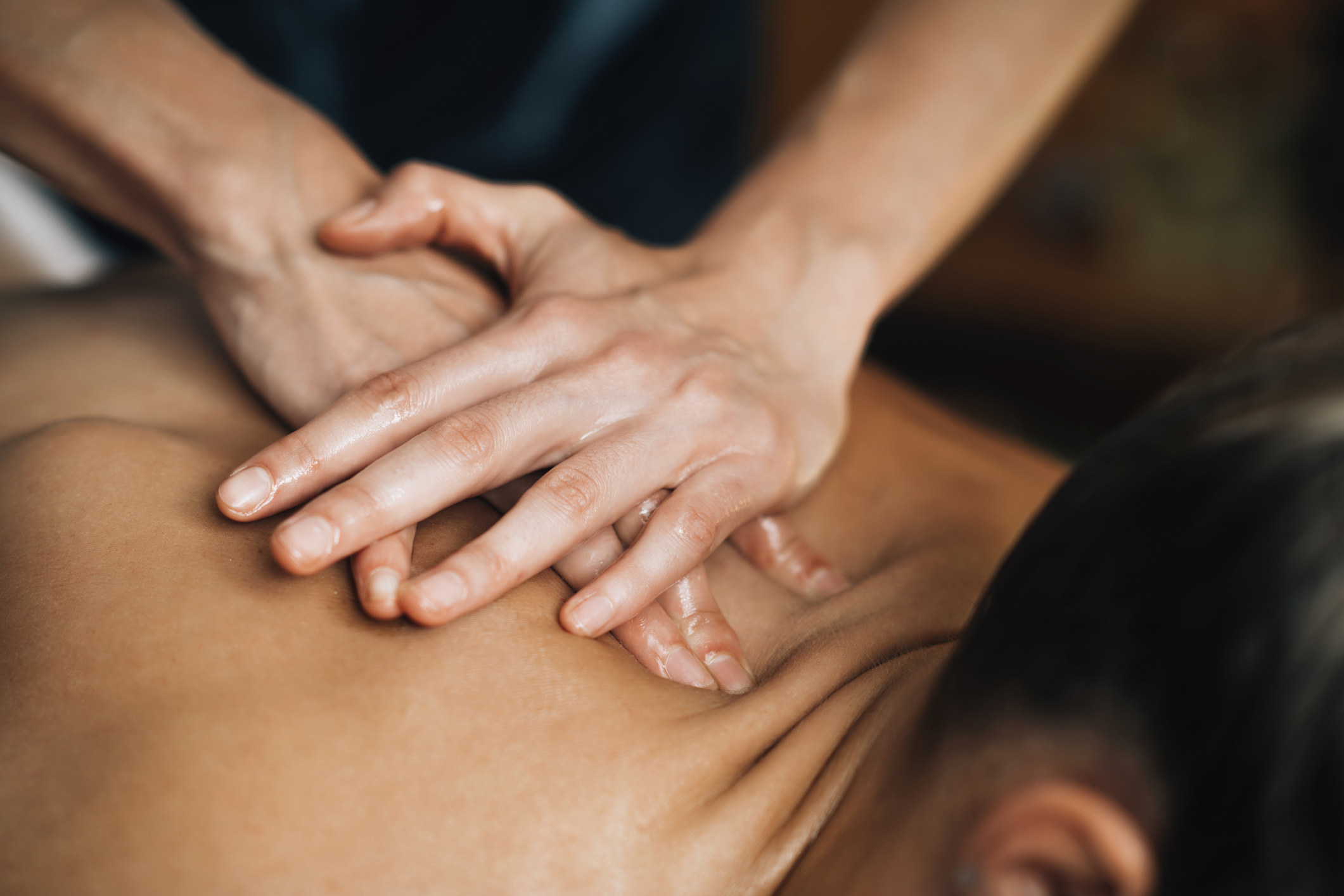 A masseur massaging someone