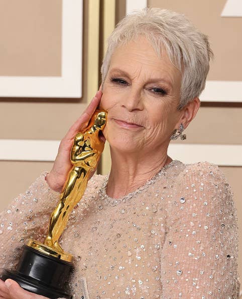 Close-up of Jamie hugging the Oscar