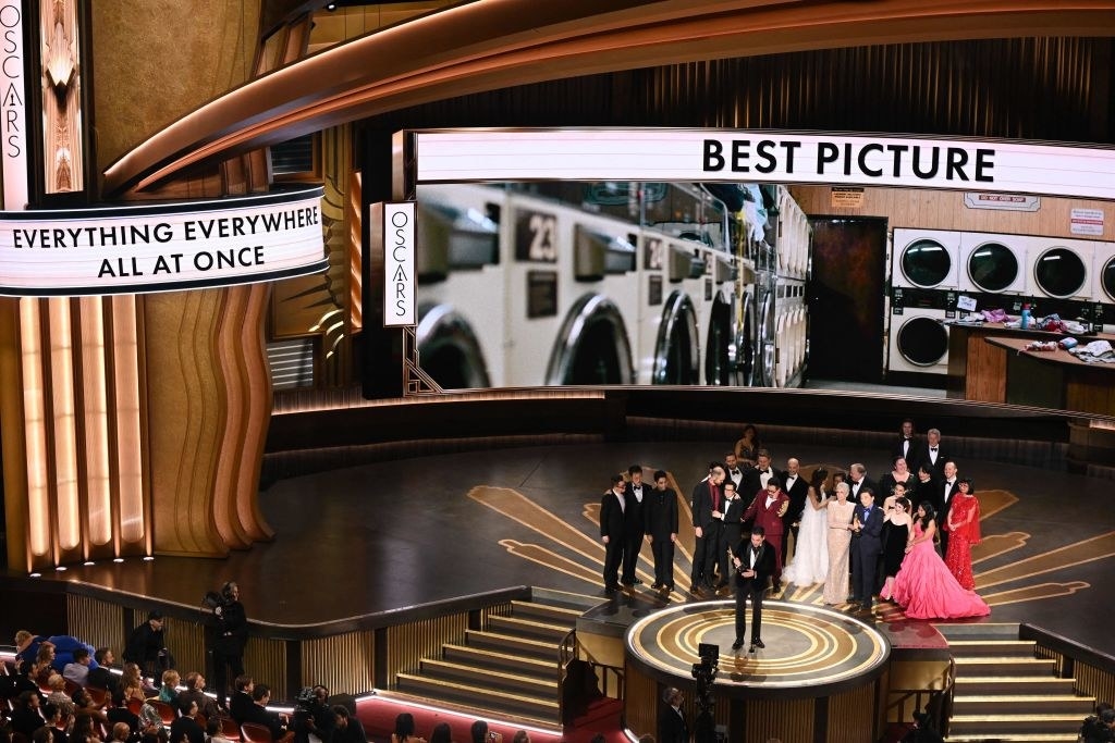 Jonathan Wang (C) accepts the Oscar for Best Picture for &quot;Everything Everywhere All at Once&quot; onstage