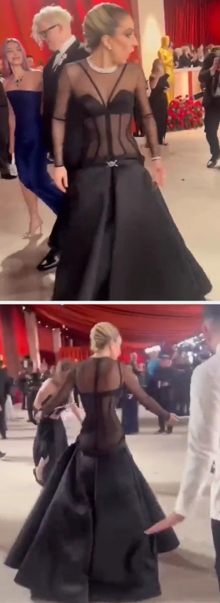 Gaga turns around and walks toward the photographer