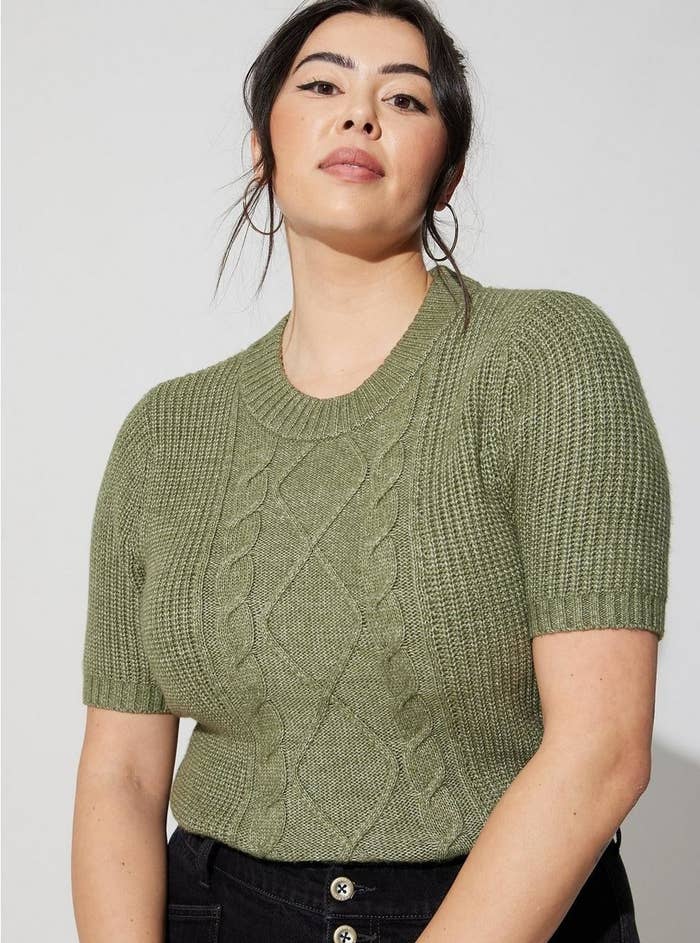 Model wearing the olive sweater
