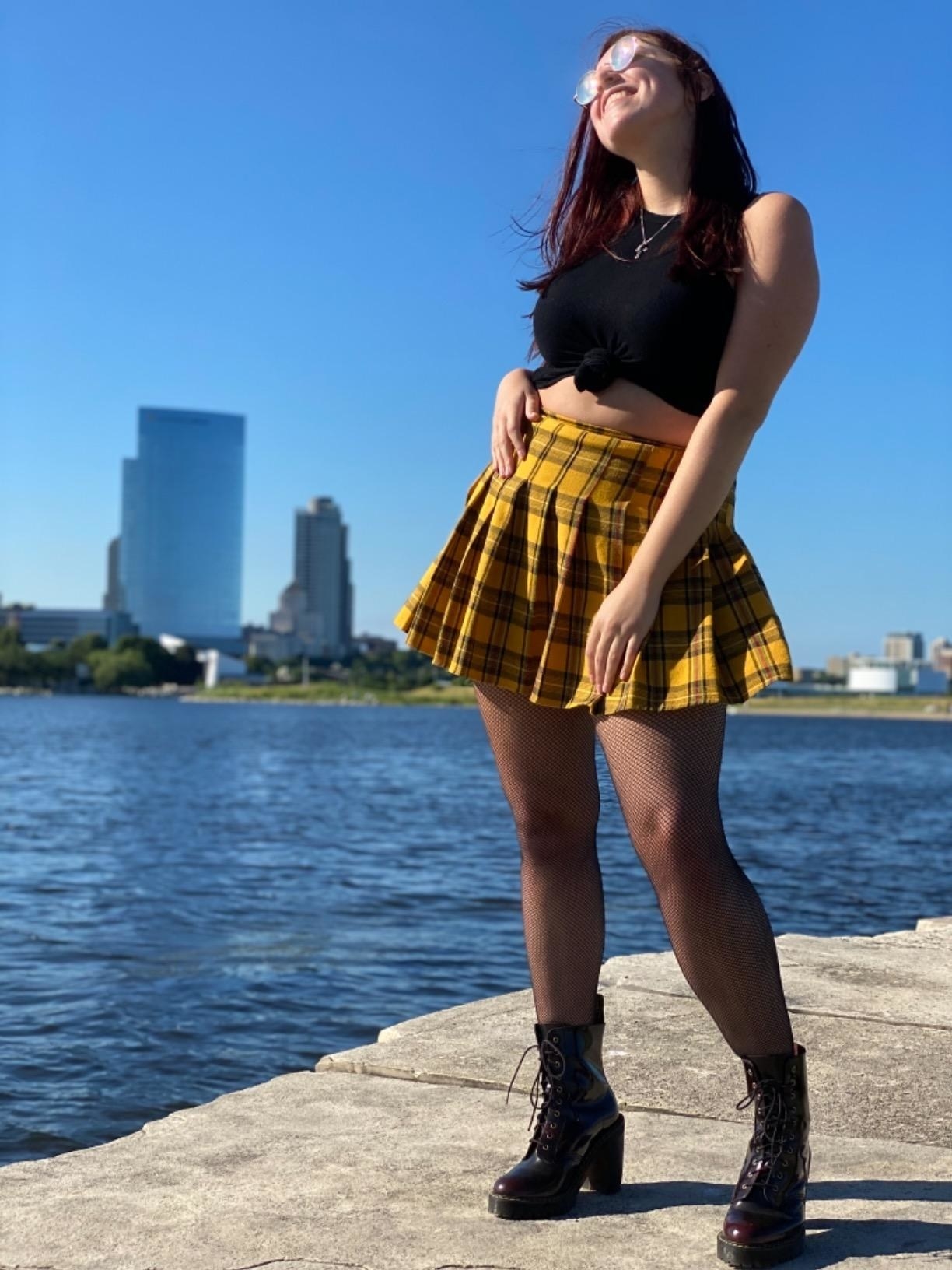 reviewer wearing the skirt in yellow plaid