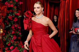 Cara Delevingne wearing an asymmetrical gown at the Oscars