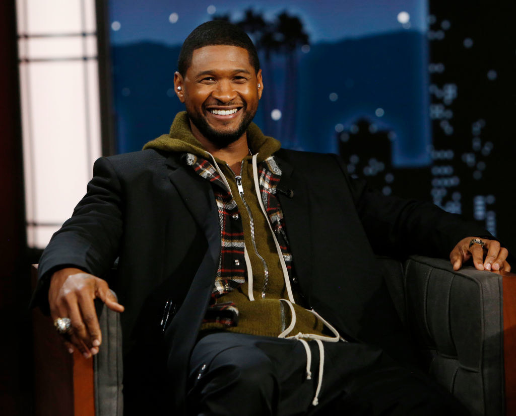 usher sitting for an interview