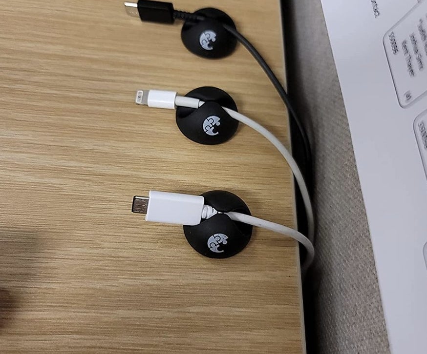 clips with chargers in the stuck to a desk