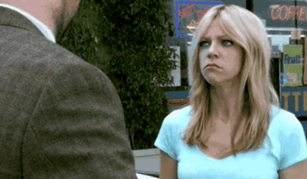 a gif of dee from its always sunny in philadelphia smiling sneakily