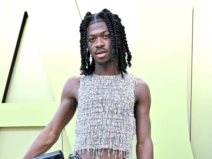 A close-up of Lil Nas X in a spangly sleeveless crop top