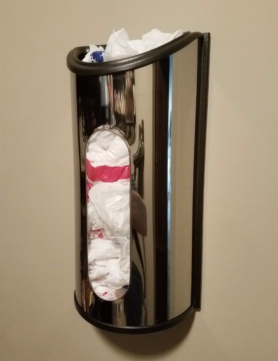 reviewer photo showing the plastic bag holder stuffed with plastic shopping bags