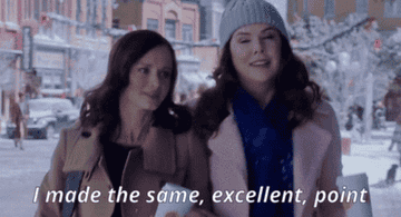 Rory and Lorelai strolling through Stars Hollow in &quot;Gilmore Girls: A Year In The Life&quot;