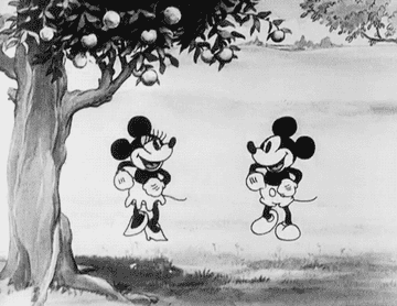 a black and white gif cartoon of mickey and minnie dancing