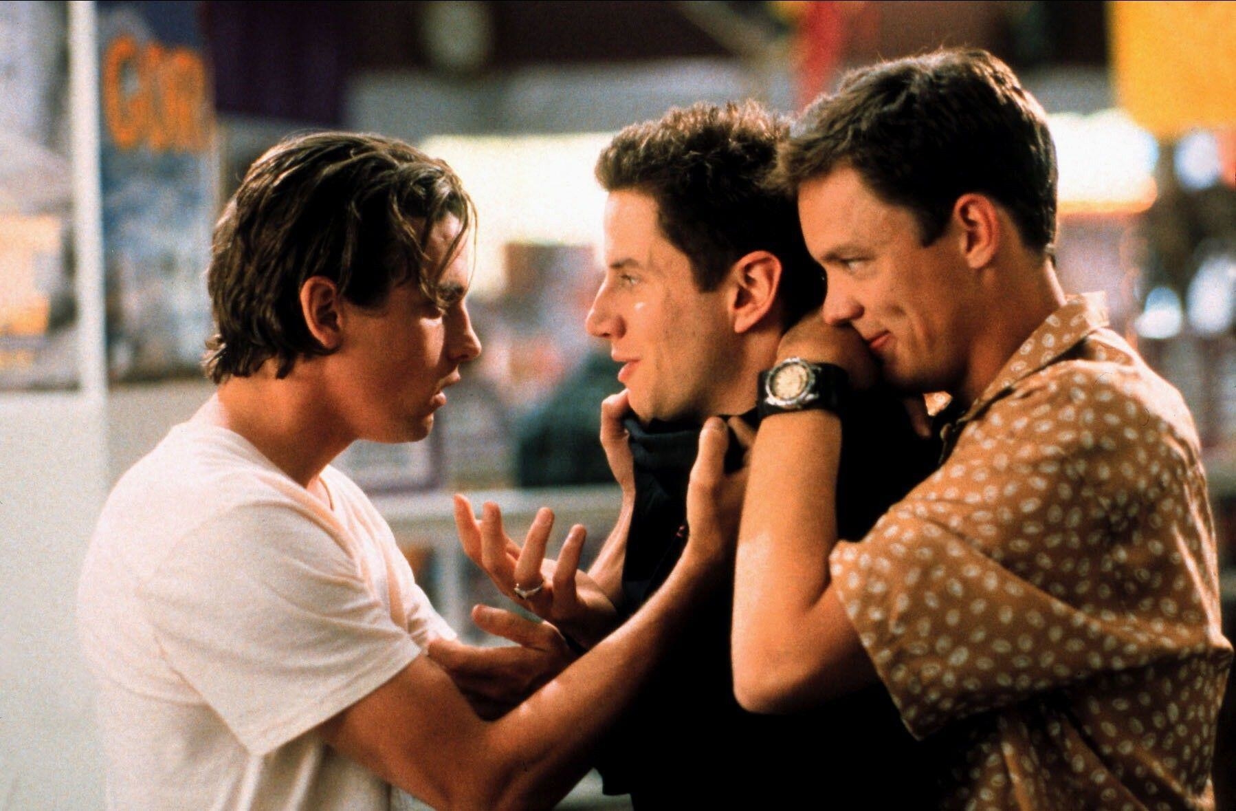 Skeet Ulrich and Matthew Lillard surround Jamie Kennedy at a video store