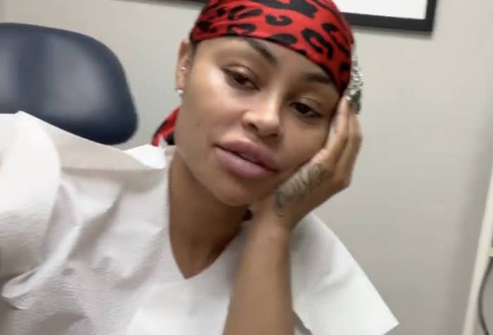 Closeup of Blac Chyna in the doctor&#x27;s office with her head in her hand as she talks