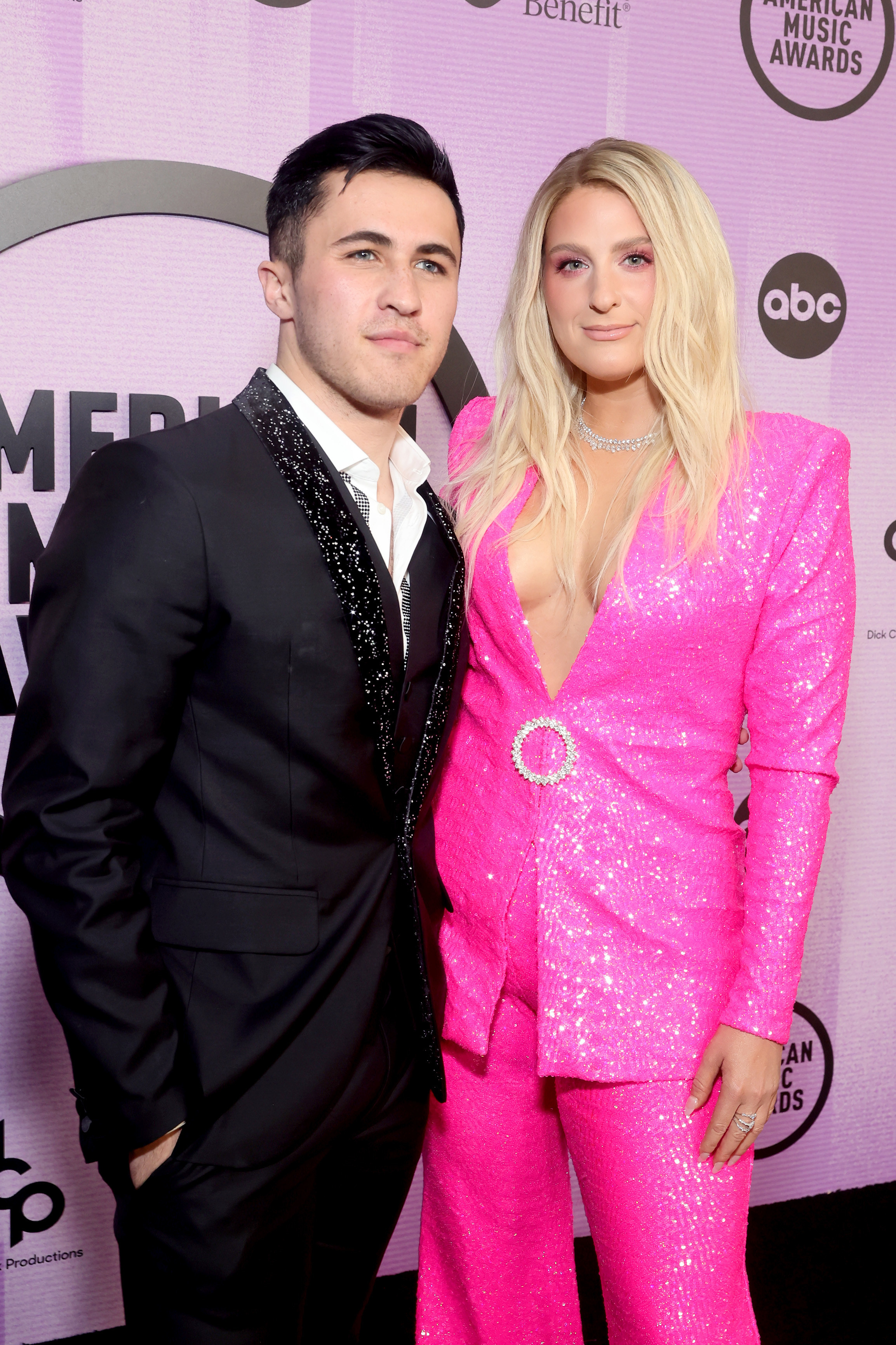 Chris and Meghan pose together at a red carpet event