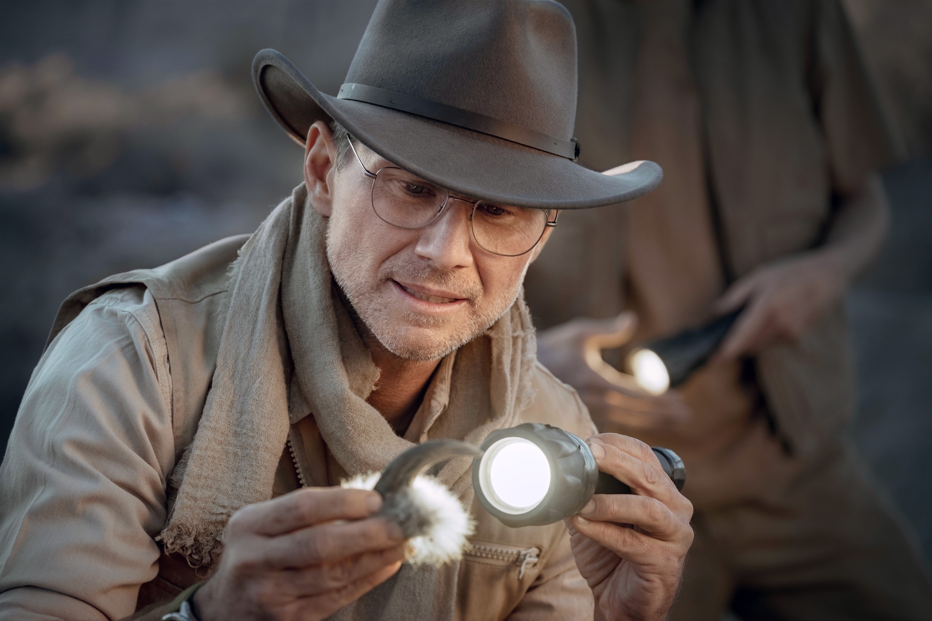 A man examines a claw