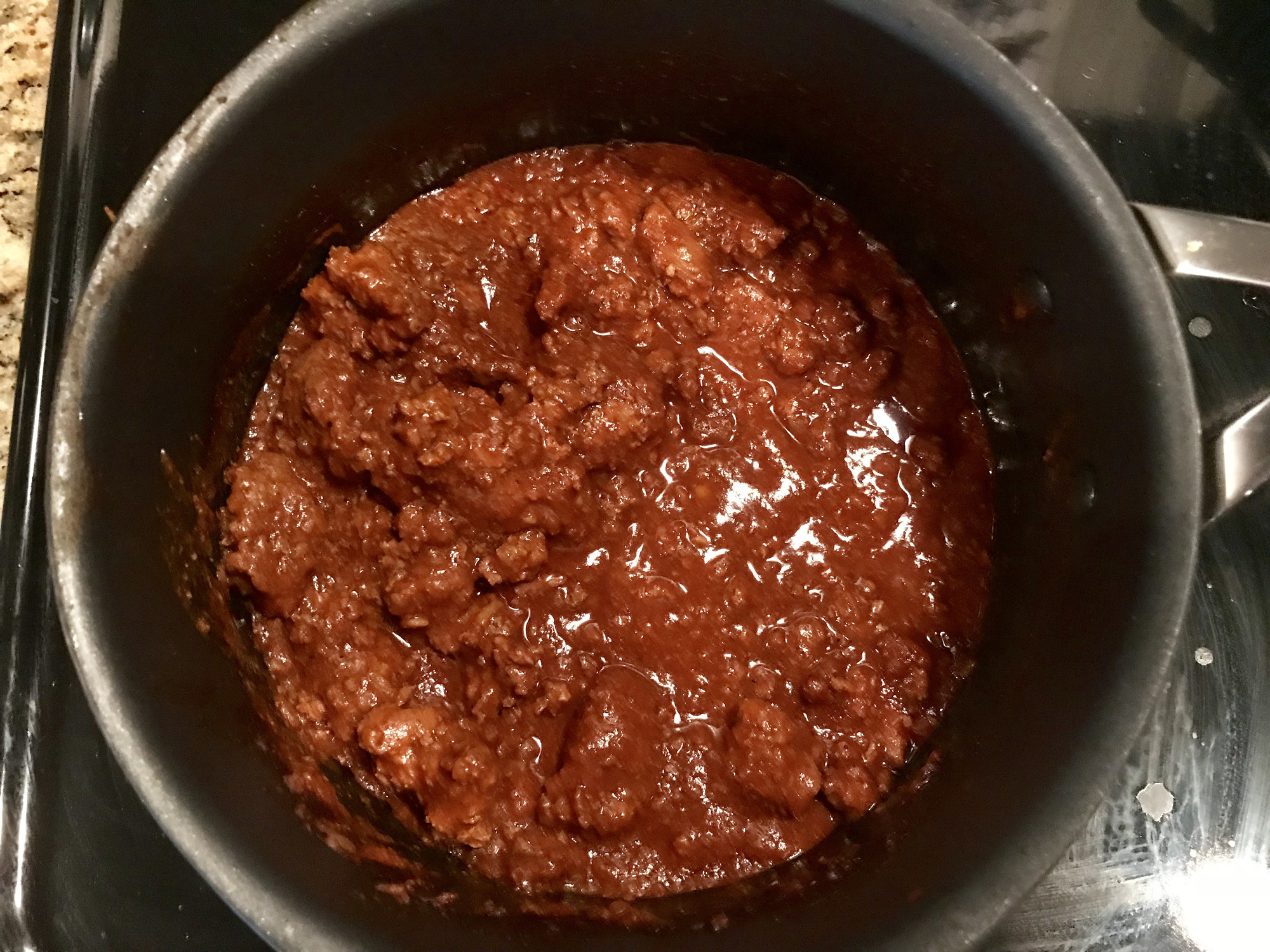 Cooking chili at home on the stove top